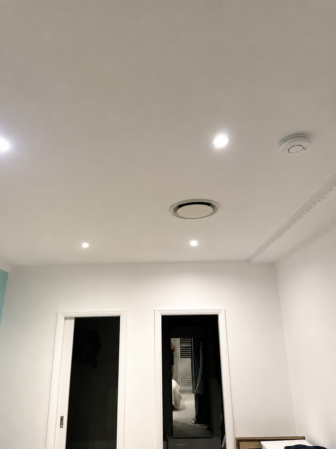 Smoke alarm installed in a finished residential bedroom